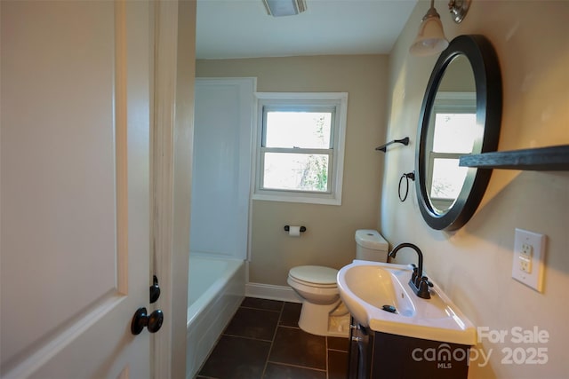 bathroom with a bath, tile patterned floors, vanity, and toilet