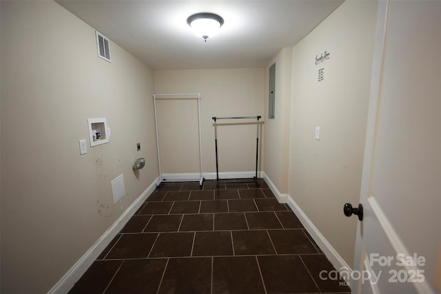 laundry area featuring washer hookup, electric panel, and dark tile patterned flooring