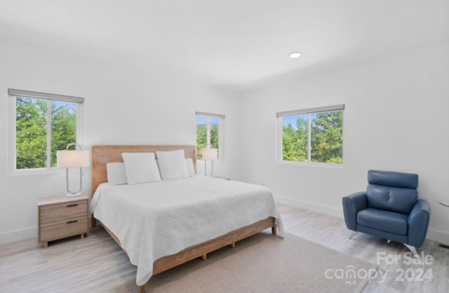 bedroom with light wood-type flooring