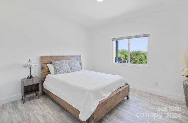 bedroom with light hardwood / wood-style floors