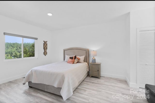 bedroom with light hardwood / wood-style flooring