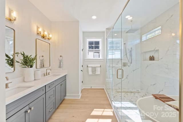 571 Lyttleton Dr, Charlotte, NC 28211 - full bath with a sink, a marble finish shower, baseboards, and wood finished floors