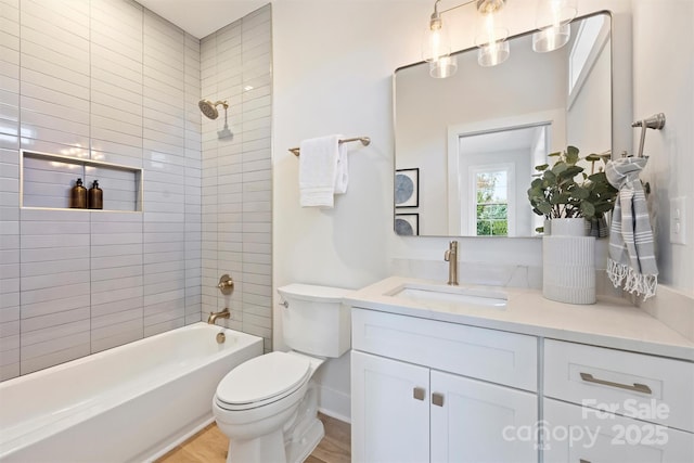 571 Lyttleton Dr, Charlotte, NC 28211 - bathroom featuring toilet, wood finished floors, vanity, and bathing tub / shower combination