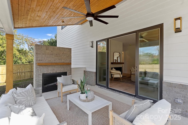 571 Lyttleton Dr, Charlotte, NC 28211 - view of patio / terrace with fence, an outdoor living space with a fireplace, and a ceiling fan