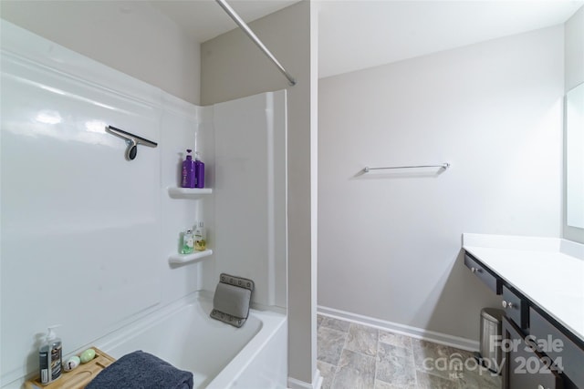 bathroom featuring vanity and bathing tub / shower combination