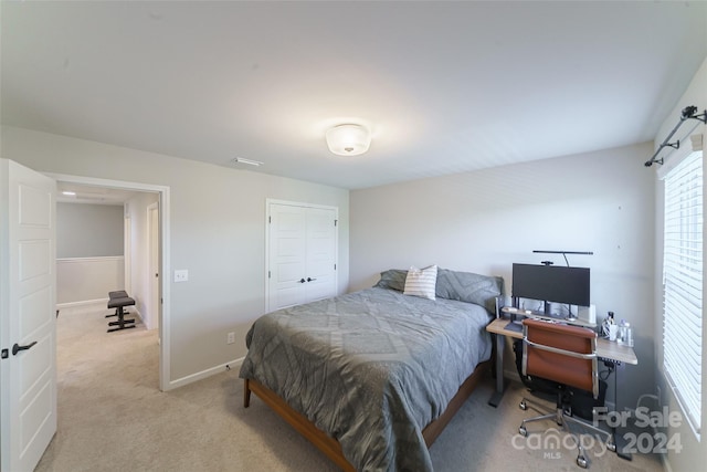 bedroom with light colored carpet