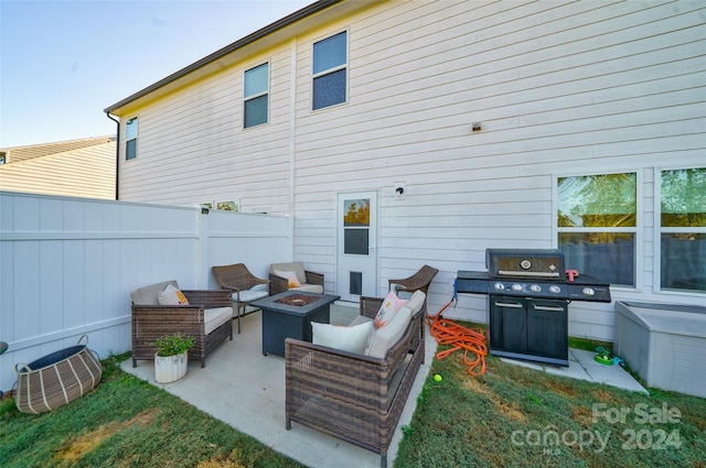 view of patio / terrace with area for grilling and an outdoor living space with a fire pit