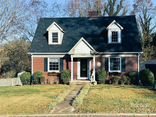 new england style home with a front lawn