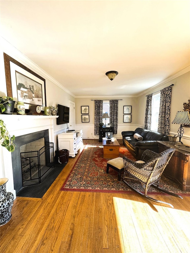 living room featuring wood-type flooring and crown molding