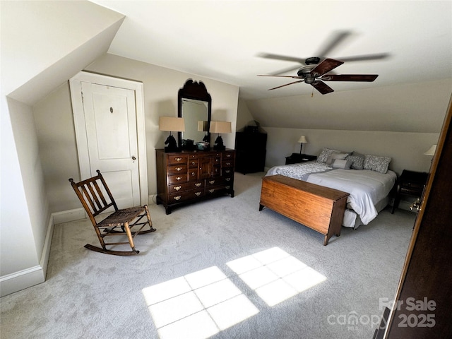 carpeted bedroom featuring vaulted ceiling and ceiling fan