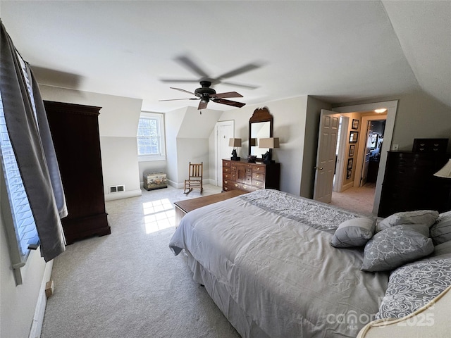 carpeted bedroom with lofted ceiling and ceiling fan