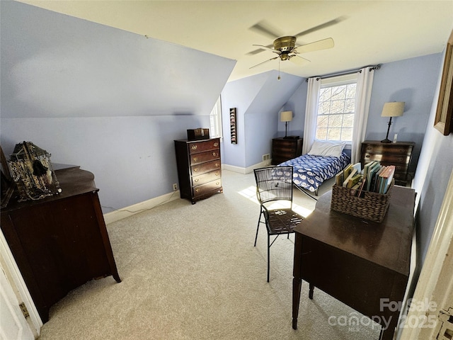 carpeted bedroom with vaulted ceiling and ceiling fan