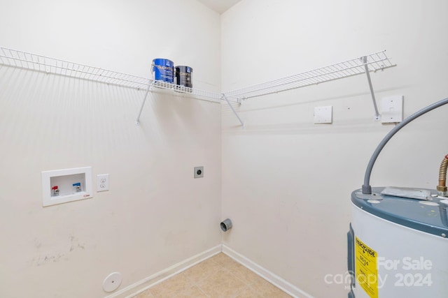 laundry area featuring electric water heater, light tile patterned flooring, electric dryer hookup, and washer hookup