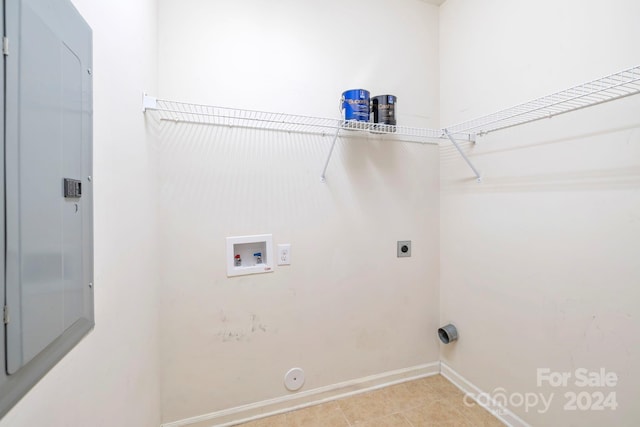 washroom featuring hookup for a gas dryer, hookup for an electric dryer, light tile patterned flooring, and washer hookup