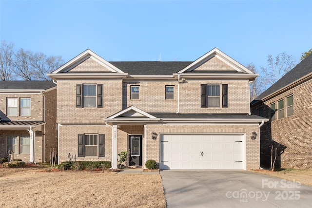 view of front of property with a garage