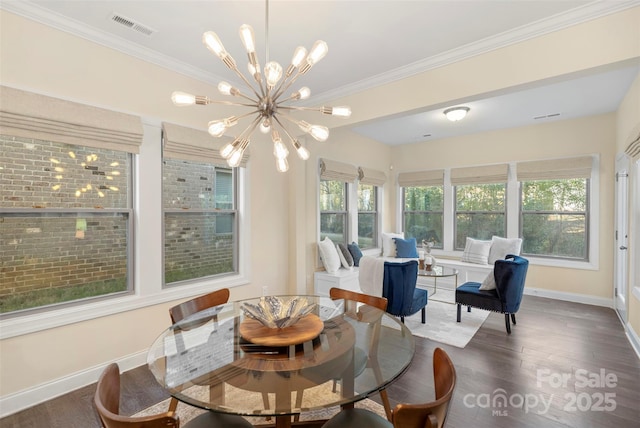 sunroom / solarium featuring an inviting chandelier