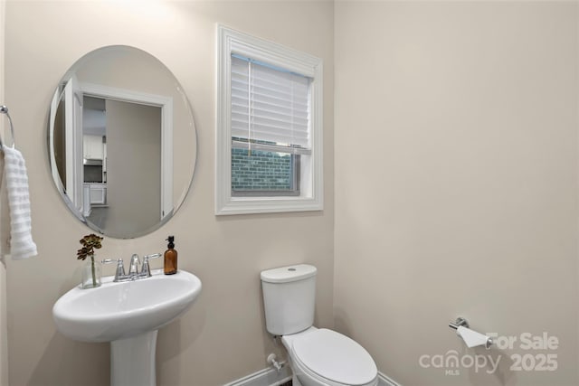 bathroom with sink and toilet