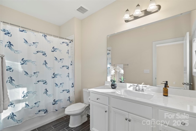 full bathroom featuring toilet, vanity, and shower / bathtub combination with curtain