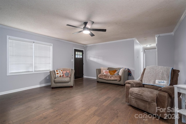 living room featuring a textured ceiling, dark hardwood / wood-style flooring, ceiling fan, and crown molding