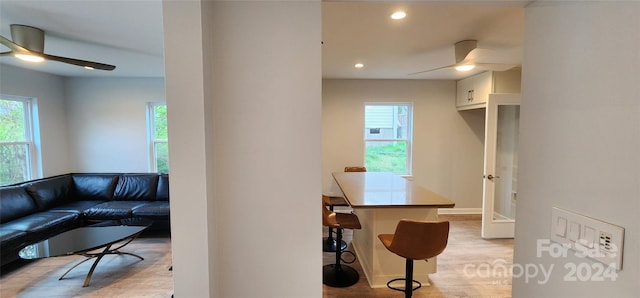 interior space with a wealth of natural light and light hardwood / wood-style flooring