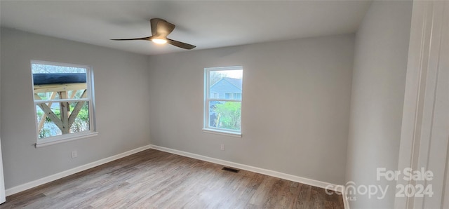 empty room featuring wood-type flooring and ceiling fan