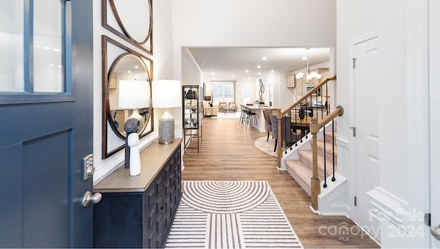 foyer featuring a chandelier and wood-type flooring