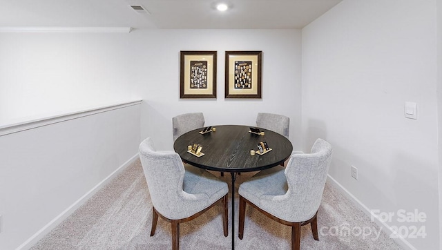 dining area featuring carpet flooring