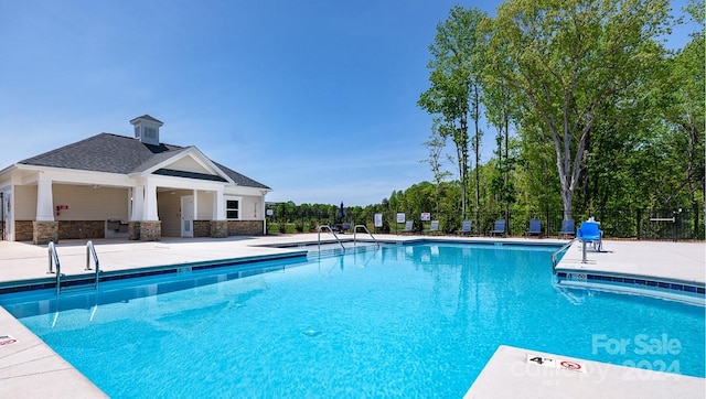 view of pool with a patio