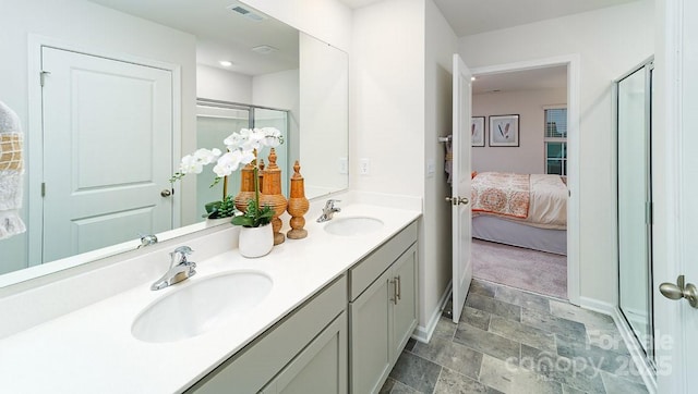 bathroom with vanity and an enclosed shower