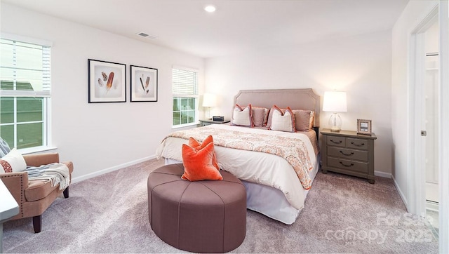 bedroom with light colored carpet