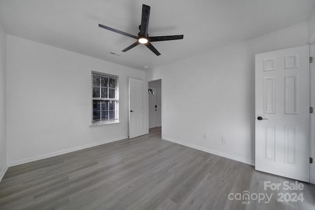 spare room featuring ceiling fan and light wood-type flooring