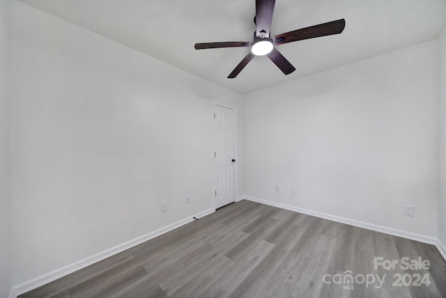 unfurnished room with ceiling fan and light hardwood / wood-style flooring