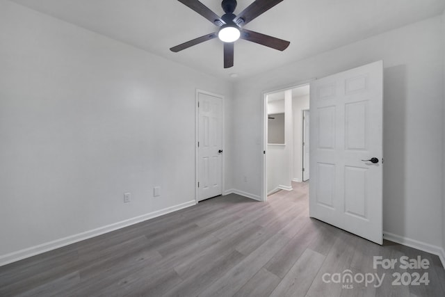 unfurnished bedroom featuring ceiling fan and light wood-type flooring