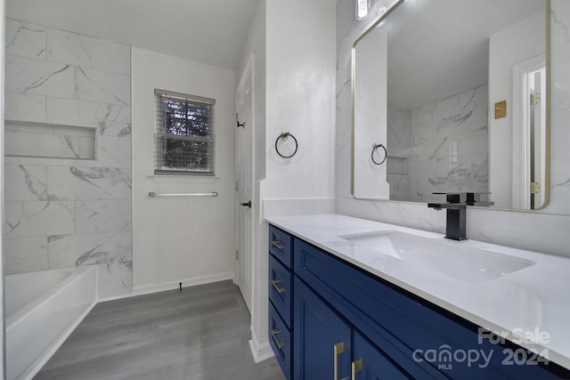 bathroom featuring vanity, hardwood / wood-style floors, and separate shower and tub