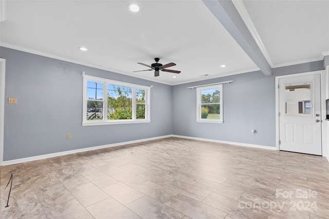 empty room with ceiling fan, ornamental molding, and beamed ceiling