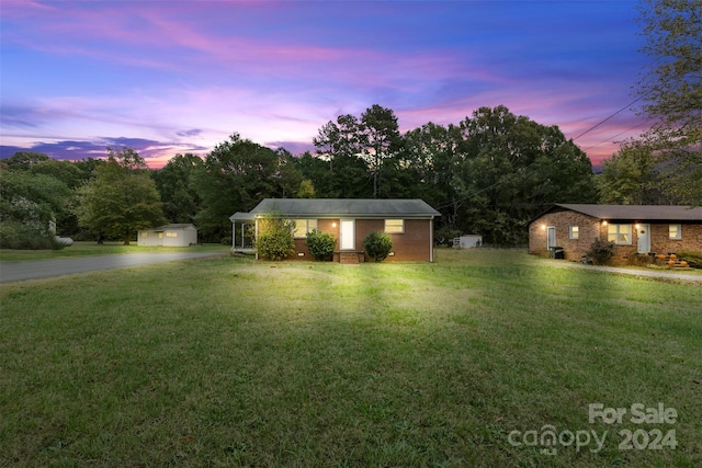2117 Charlotte Hwy, Mooresville, NC 28117 - view of front facade featuring a lawn, an outbuilding, and a garage