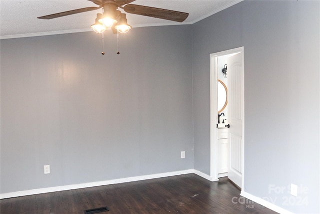 spare room featuring ornamental molding, ceiling fan, a textured ceiling, and dark hardwood / wood-style flooring