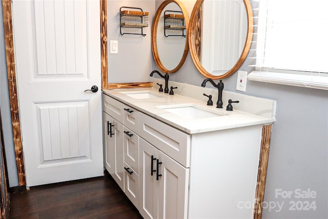 bathroom with vanity and hardwood / wood-style flooring