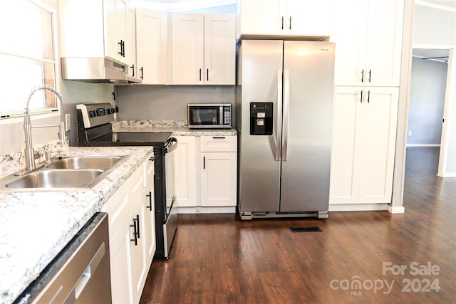 kitchen with sink, white cabinets, stainless steel appliances, and dark hardwood / wood-style floors