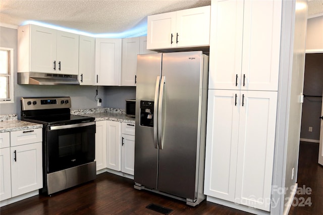 kitchen with white cabinetry, stainless steel appliances, a textured ceiling, and dark hardwood / wood-style flooring