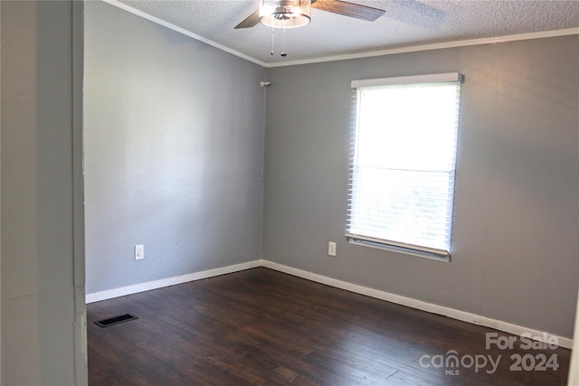 spare room with crown molding, a textured ceiling, ceiling fan, and dark hardwood / wood-style flooring