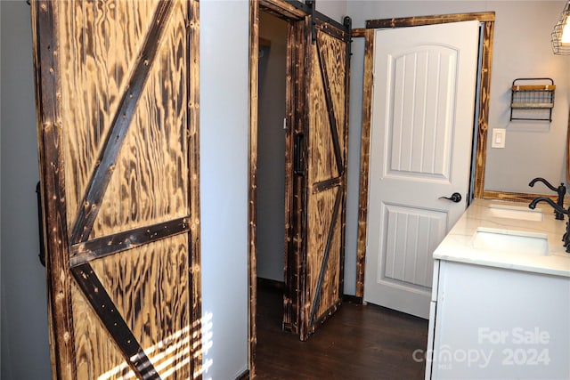 bathroom with vanity and hardwood / wood-style floors