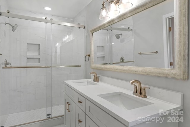 bathroom featuring vanity and walk in shower