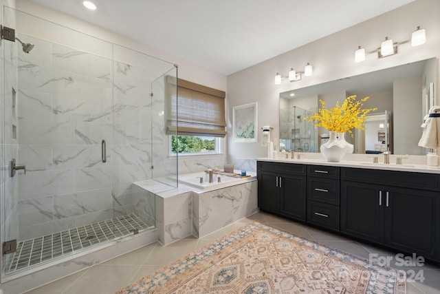 bathroom featuring vanity, separate shower and tub, and tile patterned flooring