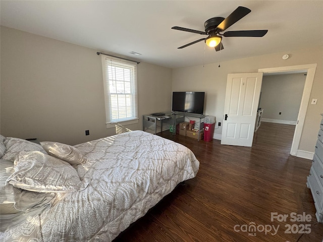 bedroom with dark wood-type flooring and ceiling fan