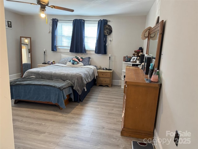 bedroom featuring ceiling fan and light hardwood / wood-style flooring