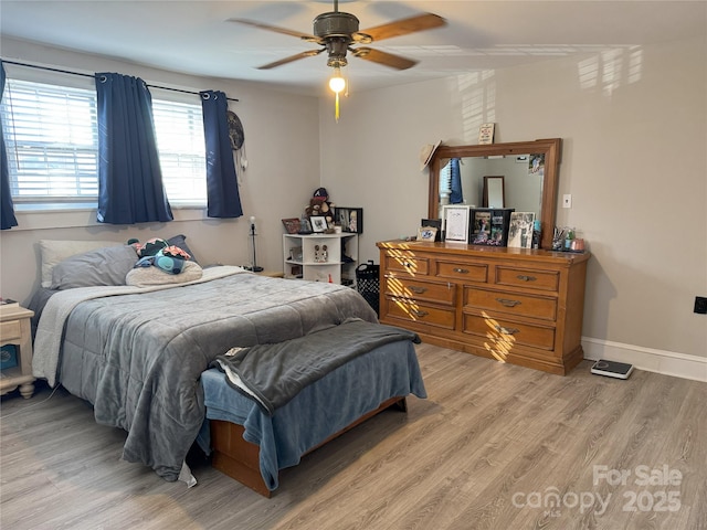 bedroom with ceiling fan and light hardwood / wood-style flooring