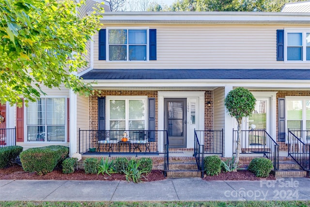 multi unit property featuring a porch