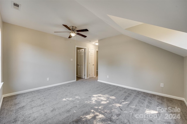 bonus room featuring lofted ceiling, carpet, and ceiling fan