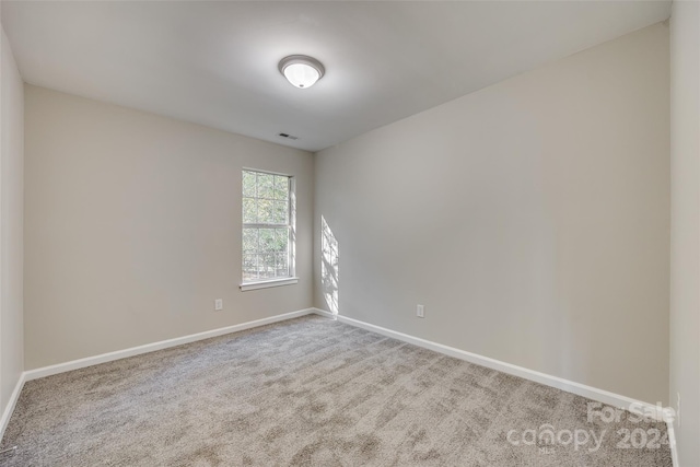 empty room featuring carpet flooring